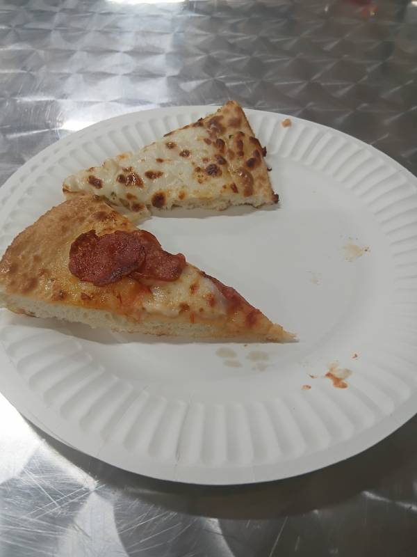 Domino's pizza slices — food referral at St John's Crisis Centre
