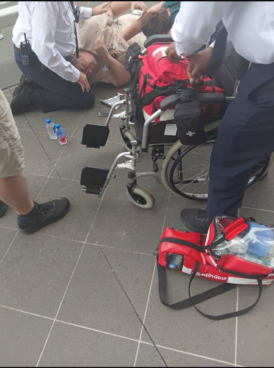 Adam Watson receiving medical treatment after collapsing — first responders attending with Mediquip equipment