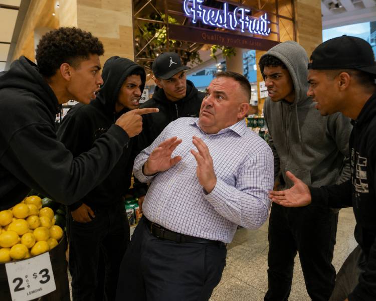 Five of RJ’s boys intimidating Mr. Watson at the Pacific Fair fruit shop